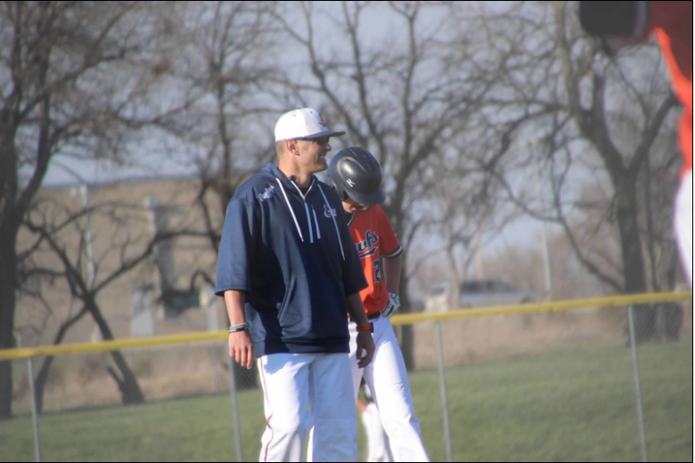 Coach Iles coaching third base as the Hawks face BVNW