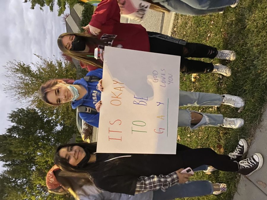 Juniors Monica Diaz, Emerson Emmy Glenn, Kennadee Brown hold up a sign at the counter protest. Photo courtsey of Natalie Ren.